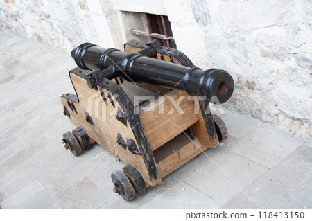 Ancient naval cannon on the wall of the fort Ancient naval cannon on the wall of the fort 118413150