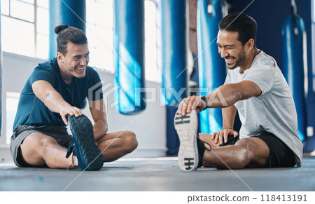 Men smile, gym and legs stretching of friends before training, fitness and workout in health club. Warmup, athlete and man ready to start sport exercise together on the floor with personal trainer Men smile, gym and legs stretching of friends before training, fitness and workout in health club. Warmup, athlete and man ready to start sport exercise together on the floor with personal trainer 118413191