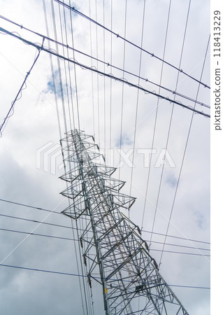 A tangle of power lines and towers A tangle of power lines and towers 118413229