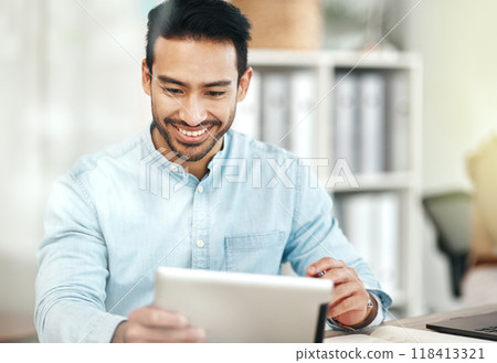 Creative asian man, tablet and smile for planning, design or social media at the office desk. Happy male employee smiling on touchscreen for business plan, strategy or online browsing at workplace Creative asian man, tablet and smile for planning, design or social media at the office desk. Happy male employee smiling on touchscreen for business plan, strategy or online browsing at workplace 118413321