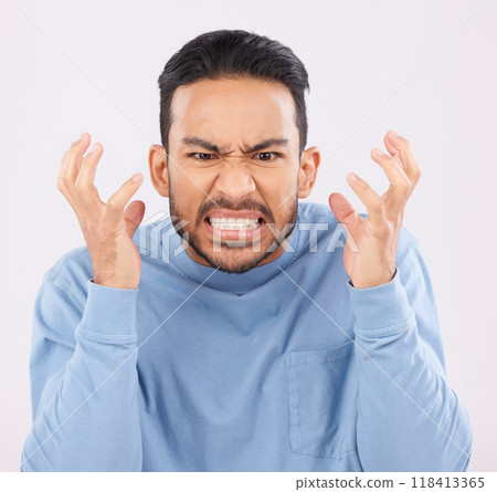 Mental health, anger and mad with a frustrated man in studio on a gray background feeling stress. Face, psychology and emotions with a young male person looking annoyed while gritting his teeth 118413365