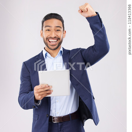 Happy businessman, portrait and tablet with fist pump in celebration for promotion win against a grey studio background. Excited asian man on technology for good news, lottery prize or sale discount 118413366