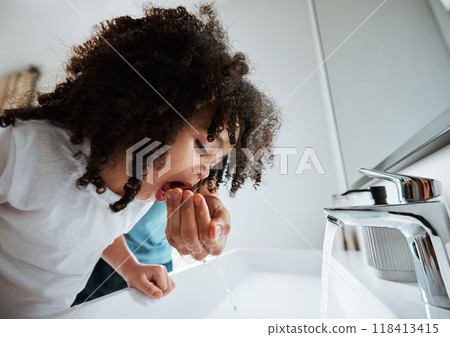 Child, dental health and water to rinse mouth with hand of a parent at a bathroom basin for wellness. African girl kid learning about brushing teeth for morning routine at home with a parent for help 118413415