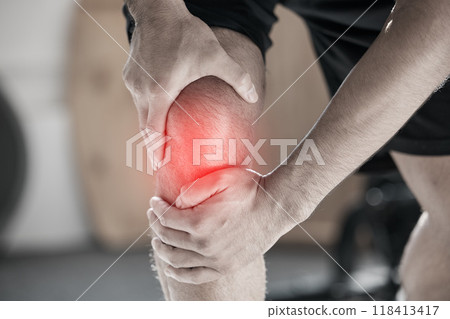 Hand, knee pain and injury with the leg of a man in red highlight during a fitness workout. Healthcare, medical and anatomy with a male athlete holding a joint after an emergency in the gym closeup 118413417