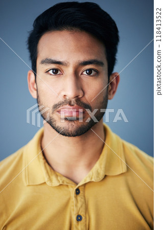 Focus, serious and portrait of a male in studio with moody, sadness or mental health problem. Tired, concentrating and Indian man model with burnout face expression isolated by gray background. Focus, serious and portrait of a male in studio with moody, sadness or mental health problem. Tired, concentrating and Indian man model with burnout face expression isolated by gray background. 118413522