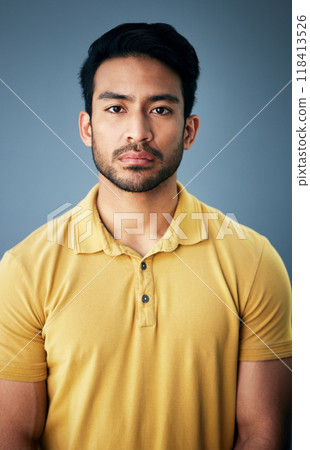 Confidence, serious and portrait of a man in studio with depression, sadness or mental health problem. Tired, exhausted and Indian male model with burnout face expression isolated by gray background. Confidence, serious and portrait of a man in studio with depression, sadness or mental health problem. Tired, exhausted and Indian male model with burnout face expression isolated by gray background. 118413526