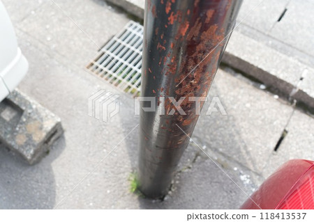 Damaged parking lot pillar Damaged parking lot pillar 118413537