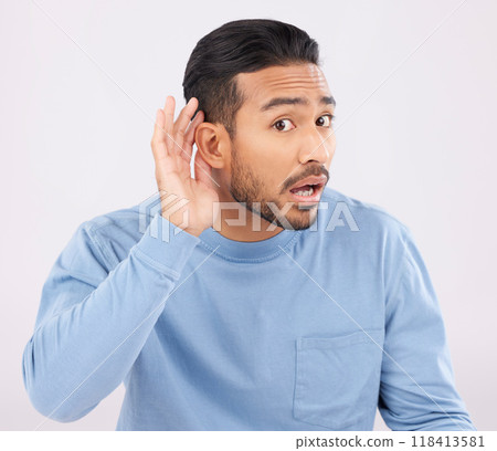 Ear, hands and portrait of asian man with listen, whisper or hearing secret, gossip or news on white background in studio. Confused, what and guy face with emoji for deaf, speak up or volume gesture 118413581