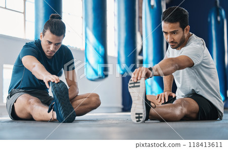 Men, gym and legs stretching of friends before training, fitness and workout in health club. Warmup, athlete and man ready to start sport exercise together on the floor with personal trainer class 118413611