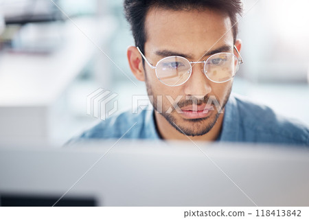 Serious, computer and business man in office for idea research, contemplating and planning. Website, technology and digital with male employee reading online for proposal, project and email news 118413842