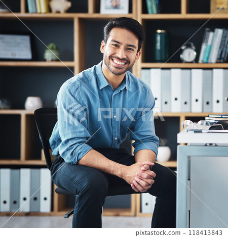 Relax, break and portrait of businessman smile and sitting in startup company office excited for the future. Young, happy and professional man employee or worker feeling confident, proud 118413843