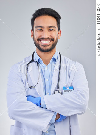 Doctor, happy man and portrait in a studio with a smile from success, motivation and stethoscope. Happiness, medical consultant and hospital worker with gray background smiling about health vision Doctor, happy man and portrait in a studio with a smile from success, motivation and stethoscope. Happiness, medical consultant and hospital worker with gray background smiling about health vision 118413888