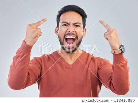 Angry, middle finger and portrait of asian man in studio for rude, conflict and problem. Annoyed, upset and aggressive with male and hand gesture on gray background for hate, disrespect and furious Angry, middle finger and portrait of asian man in studio for rude, conflict and problem. Annoyed, upset and aggressive with male and hand gesture on gray background for hate, disrespect and furious 118413890