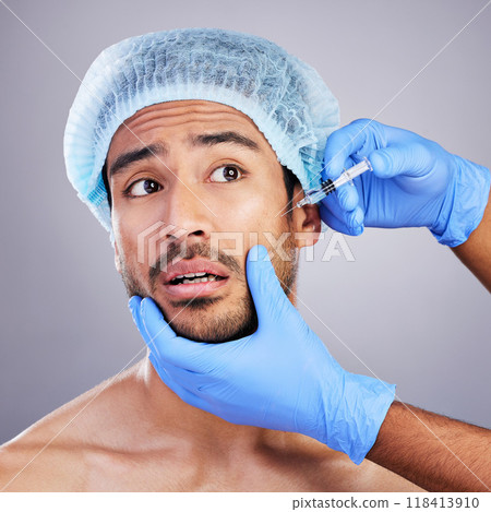 Scared, man or plastic surgery injection for facelift or cosmetics isolated in studio on white background. Hands, fear or worried Asian male person with needle for skin beauty in medical procedure Scared, man or plastic surgery injection for facelift or cosmetics isolated in studio on white background. Hands, fear or worried Asian male person with needle for skin beauty in medical procedure 118413910