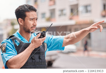 Asian man, police and pointing with walkie talkie in city for emergency dispatch, arrest or calling suspect. Male person, cop or law enforcement with radio signal for communication or safety in town Asian man, police and pointing with walkie talkie in city for emergency dispatch, arrest or calling suspect. Male person, cop or law enforcement with radio signal for communication or safety in town 118413913