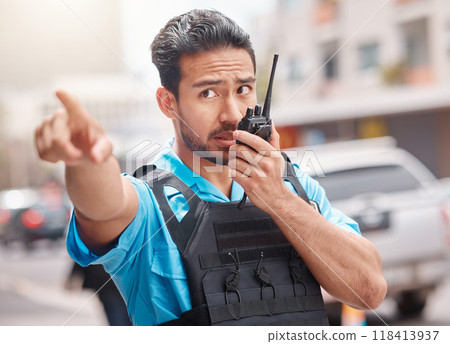 Man, police and pointing with walkie talkie in city for emergency dispatch, arrest or calling suspect. Male person, cop or law enforcement in radio signal for communication and safety in town street Man, police and pointing with walkie talkie in city for emergency dispatch, arrest or calling suspect. Male person, cop or law enforcement in radio signal for communication and safety in town street 118413937
