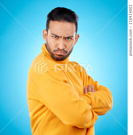 Portrait, frown and asian man with arms crossed in studio angry, frustrated and annoyed on blue background. Conflict, anger and face of Japanese male with defensive body language, denial or offended Portrait, frown and asian man with arms crossed in studio angry, frustrated and annoyed on blue background. Conflict, anger and face of Japanese male with defensive body language, denial or offended 118414001