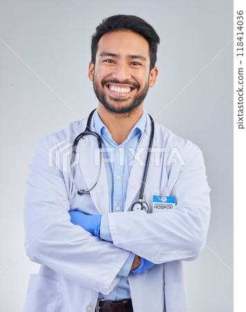 Doctor, man and portrait in a studio with a smile from success, motivation and stethoscope. Happiness, medical consultant and hospital worker with white background smiling about health and wellness Doctor, man and portrait in a studio with a smile from success, motivation and stethoscope. Happiness, medical consultant and hospital worker with white background smiling about health and wellness 118414036