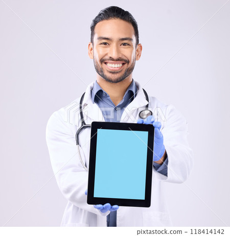 Tablet, green screen and doctor portrait isolated on a white background technology for telehealth service mockup. Medical professional or healthcare asian man with digital app mock up space in studio Tablet, green screen and doctor portrait isolated on a white background technology for telehealth service mockup. Medical professional or healthcare asian man with digital app mock up space in studio 118414142