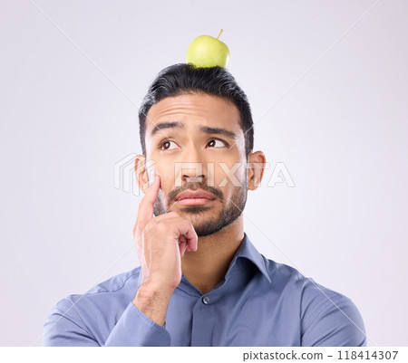 Apple, head balance and man thinking of fruit product choice for weight loss diet, healthcare food or detox. Nutritionist face, studio person and contemplating male vegan isolated on gray background 118414307
