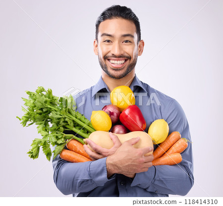 Healthy, happy and portrait of an Asian man with vegetables isolated on a white background in a studio. Smile, holding and a Japanese male with food for a diet, vegan lifestyle and nutrition 118414310