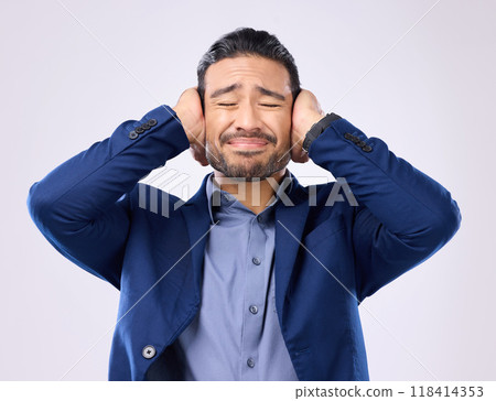 Employee, noise and Asian man cover ears, stress and mental health against a grey studio background. Japan, male and guy with hands on temples, loud and depression with frustration, audio and sound 118414353