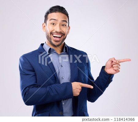 Happy, portrait and man in a studio pointing to mockup for marketing, advertising or product placement. Happiness, smile and male model from India with showing gesture for mock up by gray background. 118414366