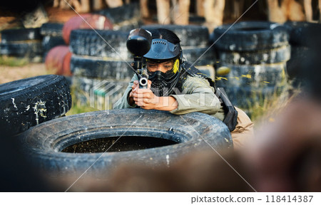 Paintball, person aim gun at target and military tactics, shooting range and war game for sports outdoor. Soldier with weapon on battlefield, action and camouflage, helmet for safety and adventure 118414387