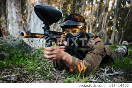 Paintball, gun and army crawl with a sports man on a battlefield for military or war training in nature. Fitness, team building and safety with a male athlete or soldier playing a game outdoor 118414402