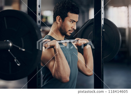 Exercise, workout and man with barbell in gym for fitness, strong muscle power or health. Bodybuilder, training and male athlete weightlifting for wellness, sports and serious focus on shoulder press Exercise, workout and man with barbell in gym for fitness, strong muscle power or health. Bodybuilder, training and male athlete weightlifting for wellness, sports and serious focus on shoulder press 118414605