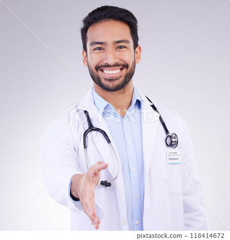 Doctor, man and handshake for healthcare partnership, meeting or greeting against a white studio background. Portrait of happy male medical professional shaking hands for introduction or thank you 118414672
