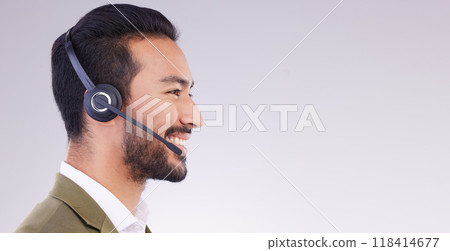 Call center, man and face profile with smile, headset and mic, CRM and contact us with mockup space. Communication, customer service or tech support, telemarketing and happy male on studio background 118414677