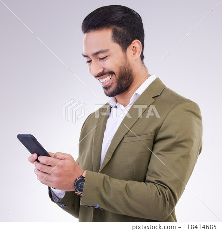 Business man, smile and phone for communication in studio while typing and networking on gray background. Asian male entrepreneur with smartphone for email, online chat or marketing on social media Business man, smile and phone for communication in studio while typing and networking on gray background. Asian male entrepreneur with smartphone for email, online chat or marketing on social media 118414685