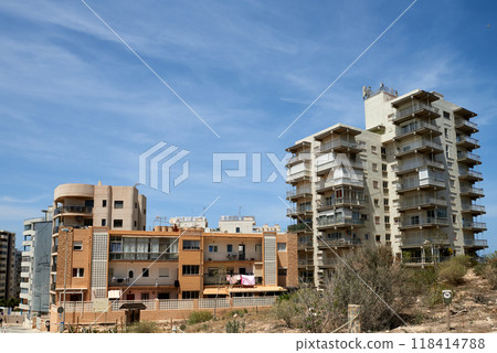 Eerie Landscapes of Spain's Housing Bust: Incomplete Developments and Desolate Neighborhoods Under Vast Skies. Remnants of Spain's Economic Downturn: Unoccupied Homes and Barren Skylines in 118414788