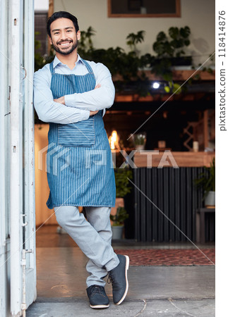 Happy, arms crossed and portrait of an Asian man at a restaurant for a welcome, service and job at the door. Smile, working and a Japanese waiter at entrance of a cafe of coffee shop in the morning 118414876