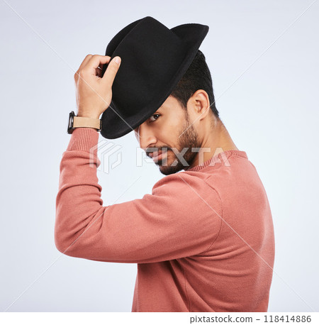 Retro, fashion and portrait of man with a hat for vintage style or hipster clothing trend in white background. Studio, Indian model and serious face with cool, confidence or person acting as a spy Retro, fashion and portrait of man with a hat for vintage style or hipster clothing trend in white background. Studio, Indian model and serious face with cool, confidence or person acting as a spy 118414886