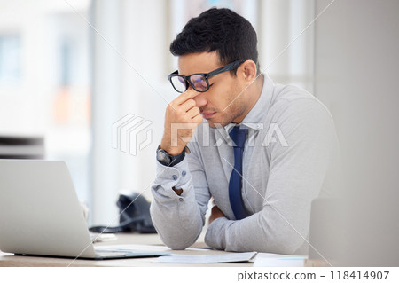 Stress, headache and business man on laptop for debt review, financial mistake and company crisis or fail. Computer, online taxes and audit employee, accountant or person with depression or problem 118414907