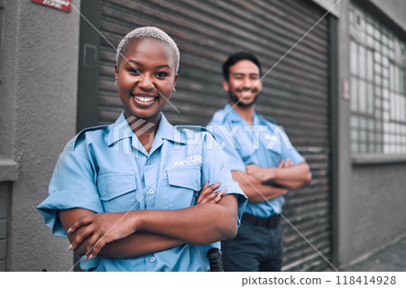 Team, security guard or safety officer portrait on the street for protection, patrol or watch. Law enforcement, smile and duty with a crime prevention unit man and woman in uniform in the city Team, security guard or safety officer portrait on the street for protection, patrol or watch. Law enforcement, smile and duty with a crime prevention unit man and woman in uniform in the city 118414928