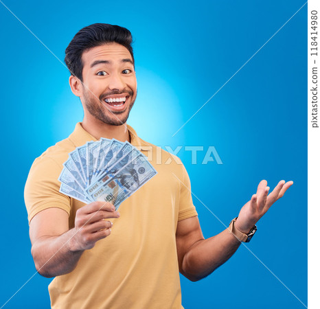 Money, studio and portrait of happy man excited for dollar bills, reward or bonus cash salary, giveaway or prize. Financial freedom, winner or person smile for income, revenue or blue background win Money, studio and portrait of happy man excited for dollar bills, reward or bonus cash salary, giveaway or prize. Financial freedom, winner or person smile for income, revenue or blue background win 118414980