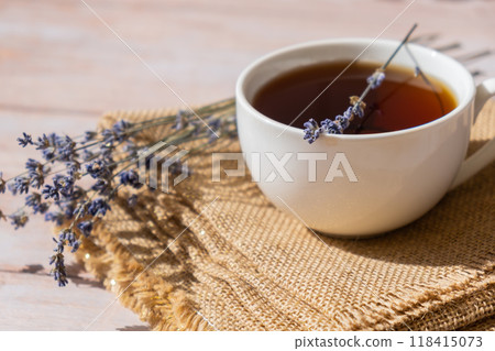 White cup of lavender tea. Mortars of dry lavender alternative medicine. Immunity boosting healthy herbal tea 118415073