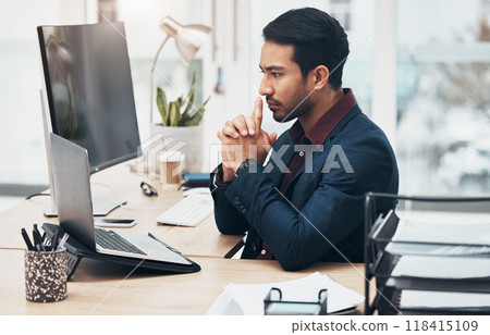 Office, thinking and ideas, man at computer brainstorming ideas for online project with focus. Planning, concentration and Indian businessman on internet search for startup business idea at desk. 118415109