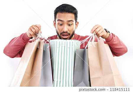 Sale, wow and shocked man with shopping bag in studio, excited for discount or purchase on white background. Deal, omg and indian guy with product from shop, mall or market while posing isolated Sale, wow and shocked man with shopping bag in studio, excited for discount or purchase on white background. Deal, omg and indian guy with product from shop, mall or market while posing isolated 118415111