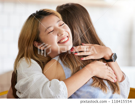 Smile, happy or friends hug in cafe bonding together on break on holiday vacation or weekend. Embrace, Asian or young women smiling in restaurant relaxing or hugging on fun date with support or unity Smile, happy or friends hug in cafe bonding together on break on holiday vacation or weekend. Embrace, Asian or young women smiling in restaurant relaxing or hugging on fun date with support or unity 118415554