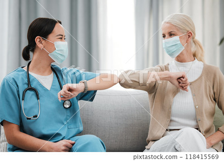 Covid greeting, mask and nursing home with Asian nurse and senior woman in retirement. Happy, handshake and healthcare clinic with a patient and wellness worker with smile and friendship in hospital Covid greeting, mask and nursing home with Asian nurse and senior woman in retirement. Happy, handshake and healthcare clinic with a patient and wellness worker with smile and friendship in hospital 118415569