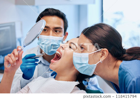 Dentist, mirror and woman check mouth after teeth whitening, service and dental care. Healthcare, dentistry and female patient with orthodontist for oral hygiene, wellness or cleaning in consultation 118415794