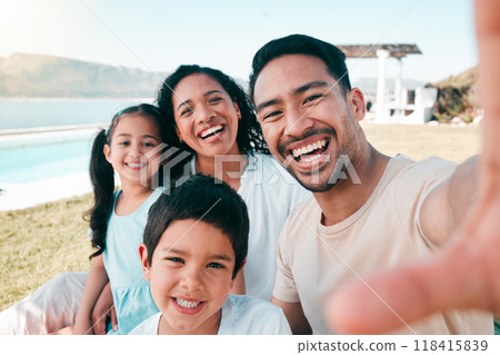 Selfie of mom, dad and kids at holiday accommodation at ocean for picnic, bonding and fun smile together. Digital photography, happy family and quality time vacation in yard of beach house in Mexico. Selfie of mom, dad and kids at holiday accommodation at ocean for picnic, bonding and fun smile together. Digital photography, happy family and quality time vacation in yard of beach house in Mexico. 118415839