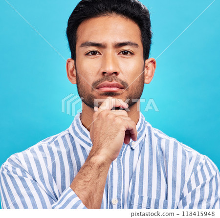 Portrait of man on blue background, thinking and serious expression and hand on face isolated on studio backdrop. Confidence, mockup space and professional male model with pride and vision for future 118415948