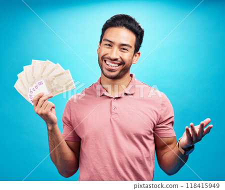 Happy man in portrait, cash fan and financial freedom with money, prize or reward isolated on blue background. Finance with savings, bonus and male person with smile and economic success in studio 118415949
