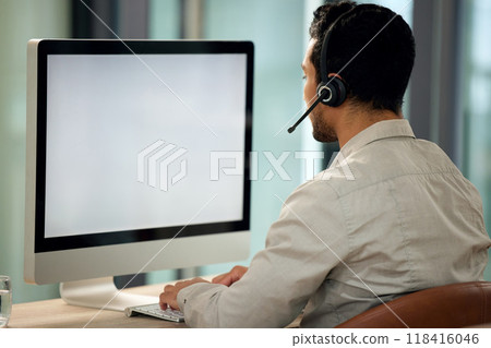 Call center, man and back with computer, typing and blank screen for copy space, telemarketing and mockup. Young male consultant, pc and customer service with advice, email or communication in office Call center, man and back with computer, typing and blank screen for copy space, telemarketing and mockup. Young male consultant, pc and customer service with advice, email or communication in office 118416046