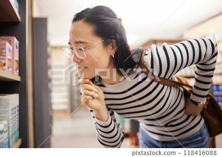 Thinking, woman and choice of shopping at shelf, retail products and reading grocery label of brand information. Female customer, decision and supermarket store for groceries, sales or consumer price 118416088